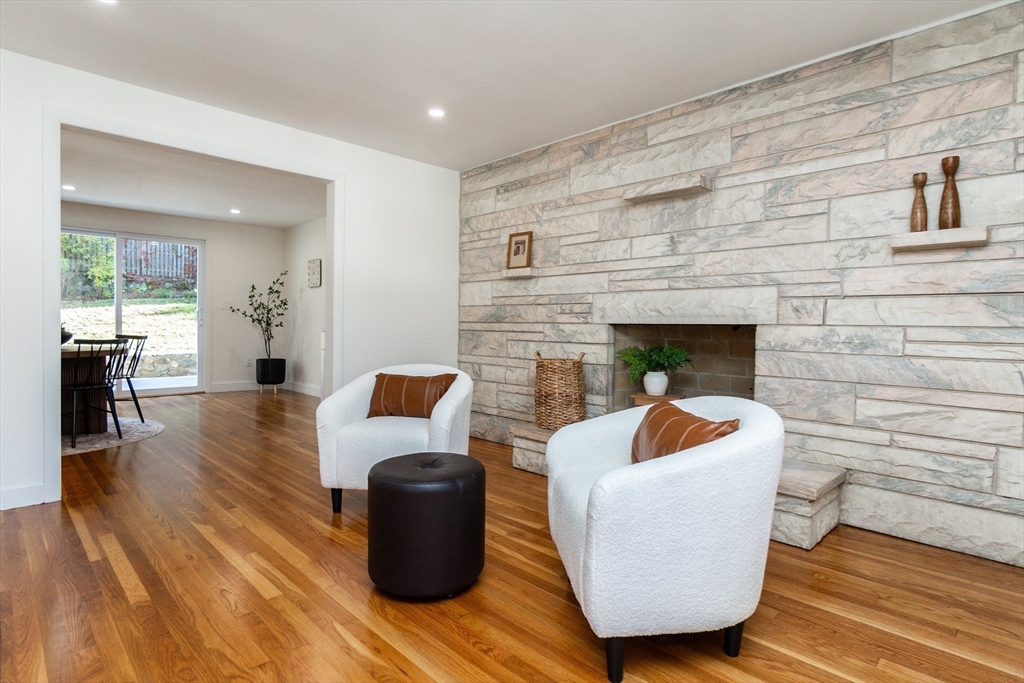 72 Outlook Road Wakefield, MA 01880 - Photo 10 of 42 a living room with furniture and a fireplace