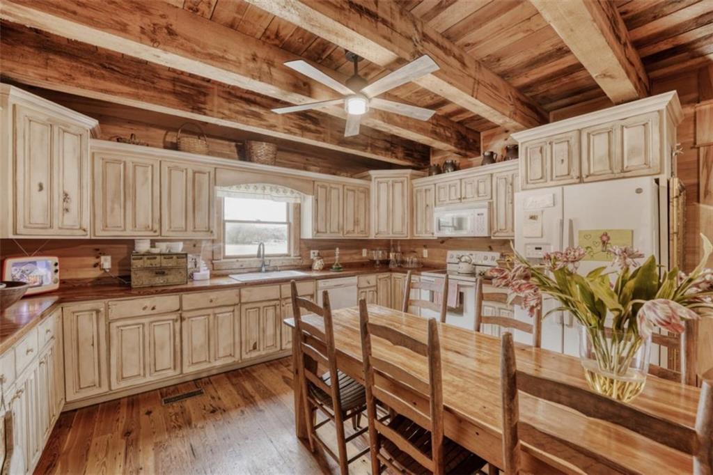 226 Vinson Mountain Road Rockmart, GA 30153 - Photo 14 of 35 a kitchen with sink table and chairs