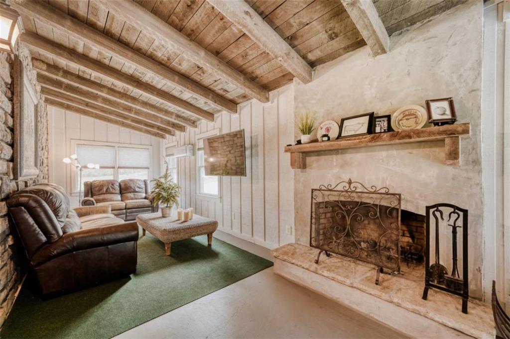 226 Vinson Mountain Road Rockmart, GA 30153 - Photo 16 of 35 a living room with furniture and a fireplace