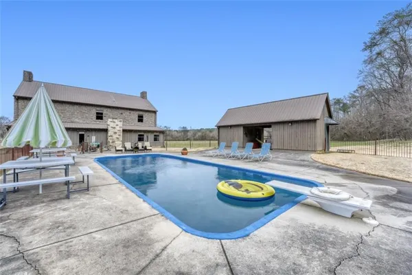 a view of a swimming pool with a lounge chairs