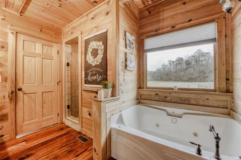 226 Vinson Mountain Road Rockmart, GA 30153 - Photo 22 of 35 a bathroom with a bathtub and shower