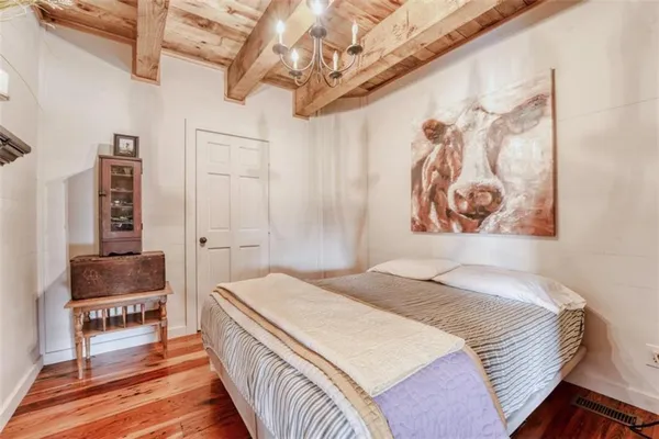 a bedroom with a bed and a couch
