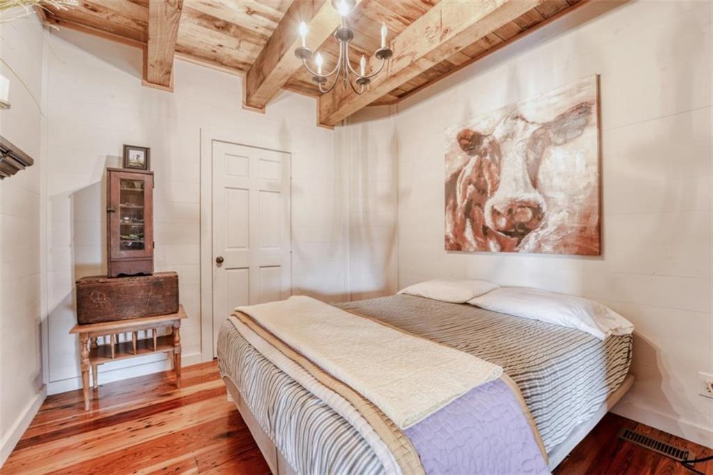 226 Vinson Mountain Road Rockmart, GA 30153 - Photo 27 of 35 a bedroom with a bed and a couch