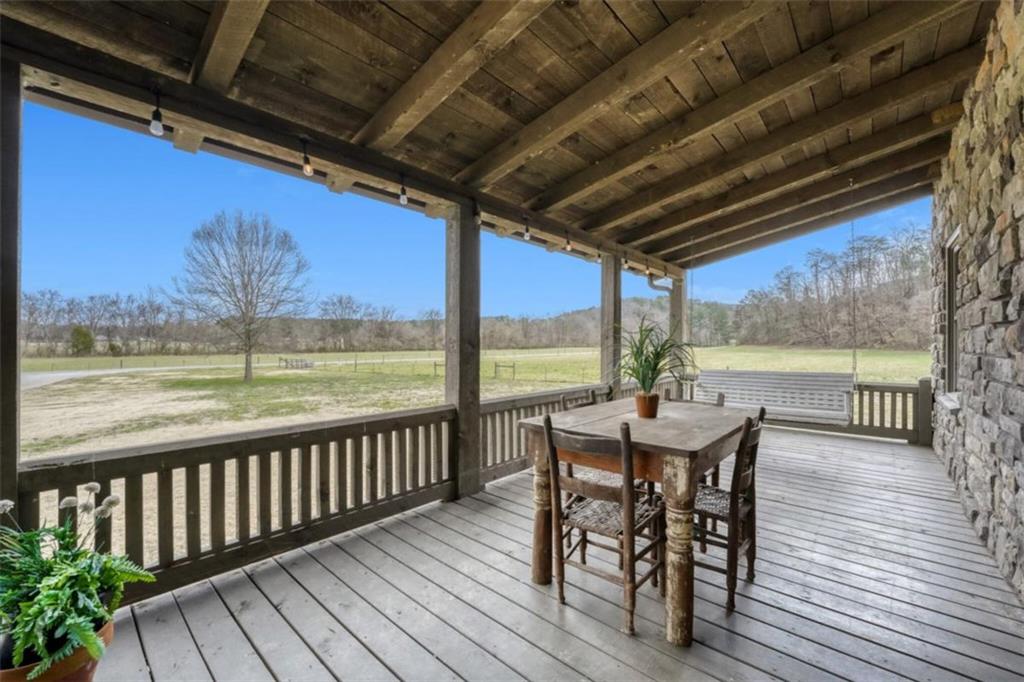 226 Vinson Mountain Road Rockmart, GA 30153 - Photo 28 of 35 a view of a dining room with furniture window and wooden floor