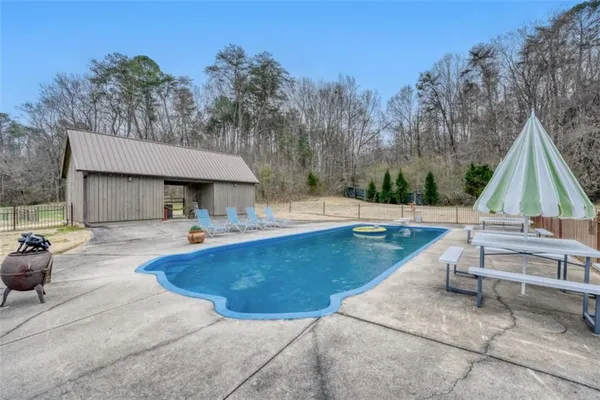 a view of outdoor space yard swimming pool and sitting area