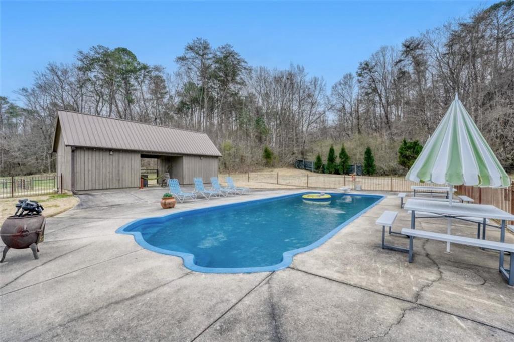 226 Vinson Mountain Road Rockmart, GA 30153 - Photo 29 of 35 a view of outdoor space yard swimming pool and sitting area