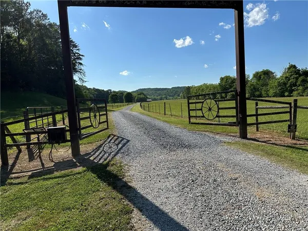 a view of a park with iron fence