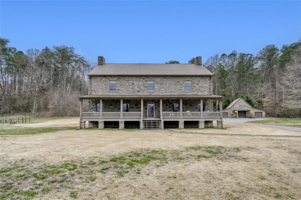 226 Vinson Mountain Road Rockmart, GA 30153 - Photo 5 of 35 a view of a house with a backyard space