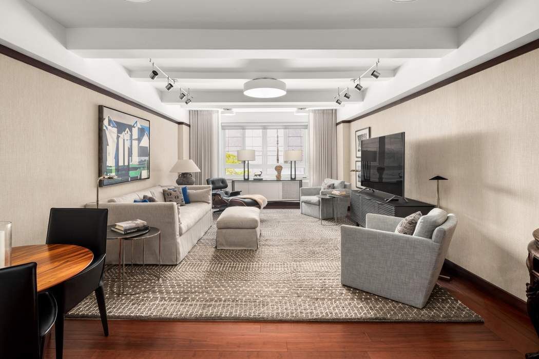 333 West 57th Street, Unit 3CD Manhattan, NY 10019 - Photo 1 of 24 a living room with furniture and a couch
