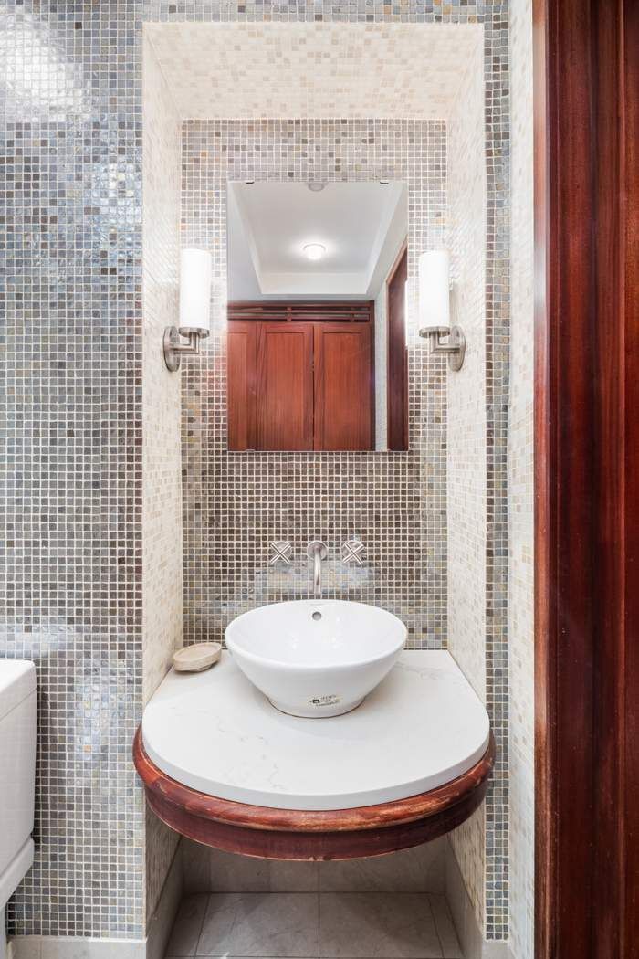 333 West 57th Street, Unit 3CD Manhattan, NY 10019 - Photo 12 of 24 a bathroom with a sink toilet and shower