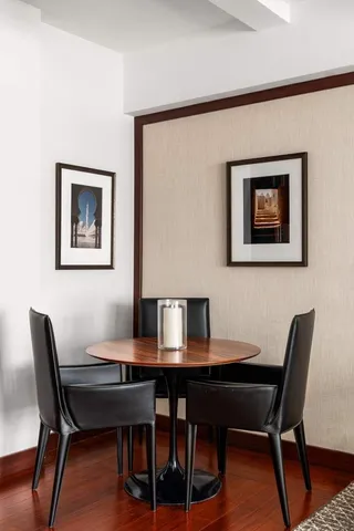 a living room with furniture and a painting