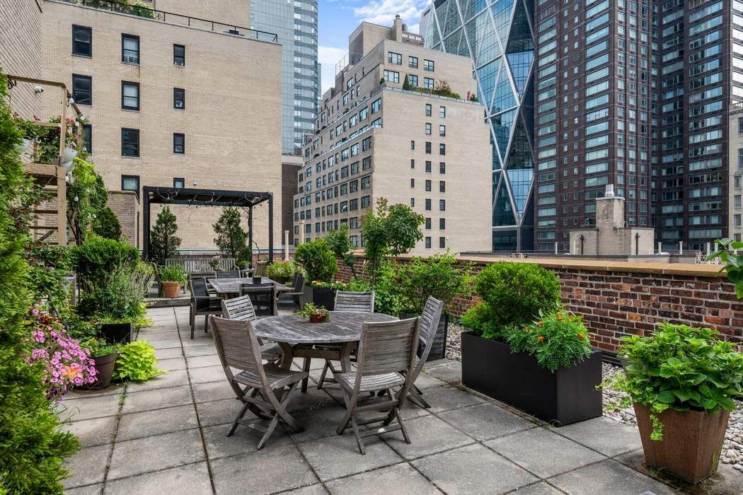 333 West 57th Street, Unit 3CD Manhattan, NY 10019 - Photo 19 of 24 a view of a patio with plants and table and chairs in patio