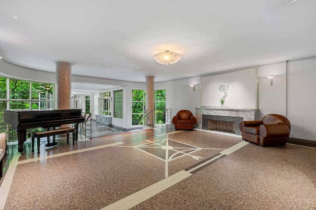 333 West 57th Street, Unit 3CD Manhattan, NY 10019 - Photo 22 of 24 a room with furniture and a large window