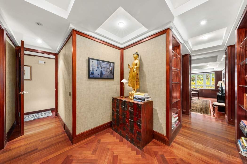 333 West 57th Street, Unit 3CD Manhattan, NY 10019 - Photo 8 of 24 a view of a hallway with furniture and wooden floor