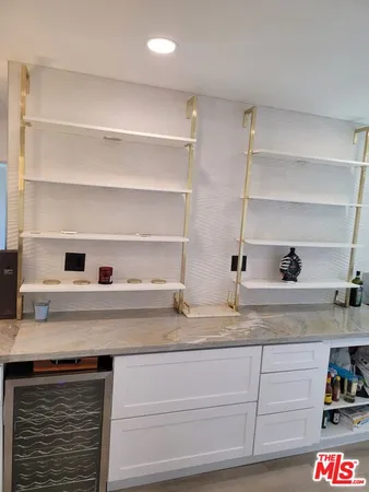 a view with granite countertop cabinets