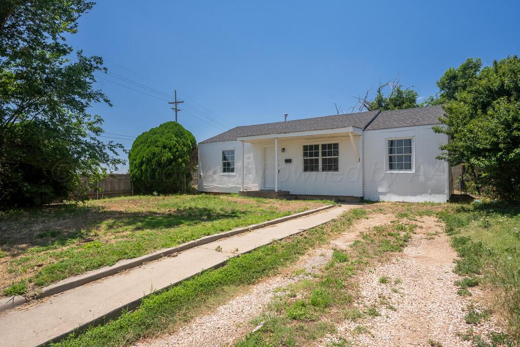 4360 South Polk Street Amarillo, TX 79110 - Photo 2 of 20 a view of backyard with large trees and plants