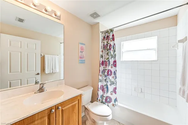a bathroom with a sink a toilet and a bathtub