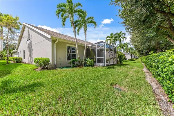 a view of a house with a backyard