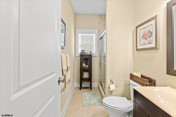 a bathroom with a toilet a sink and a bathtub