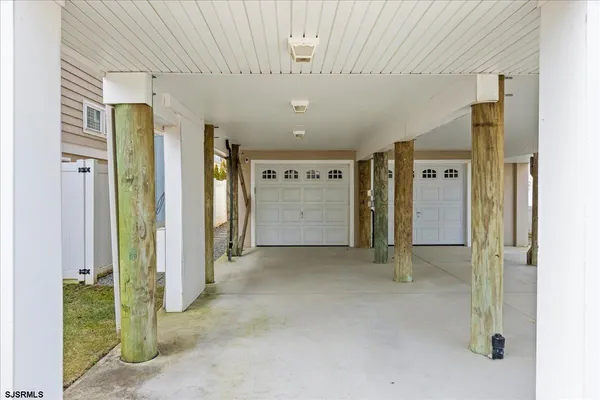 a view of a hallway with staircase