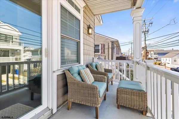 a balcony with furniture and city view