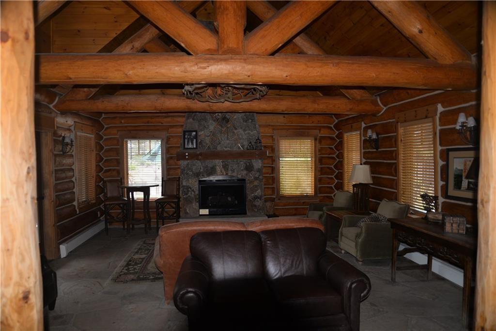65 Wolf Rock Road Keystone, CO 80435 - Photo 9 of 15 a living room with furniture a fireplace and a table