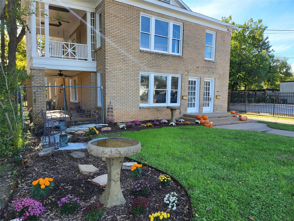 5322 Junius Street Dallas, TX 75214 - Photo 1 of 1 a front view of a house with swimming pool and garden