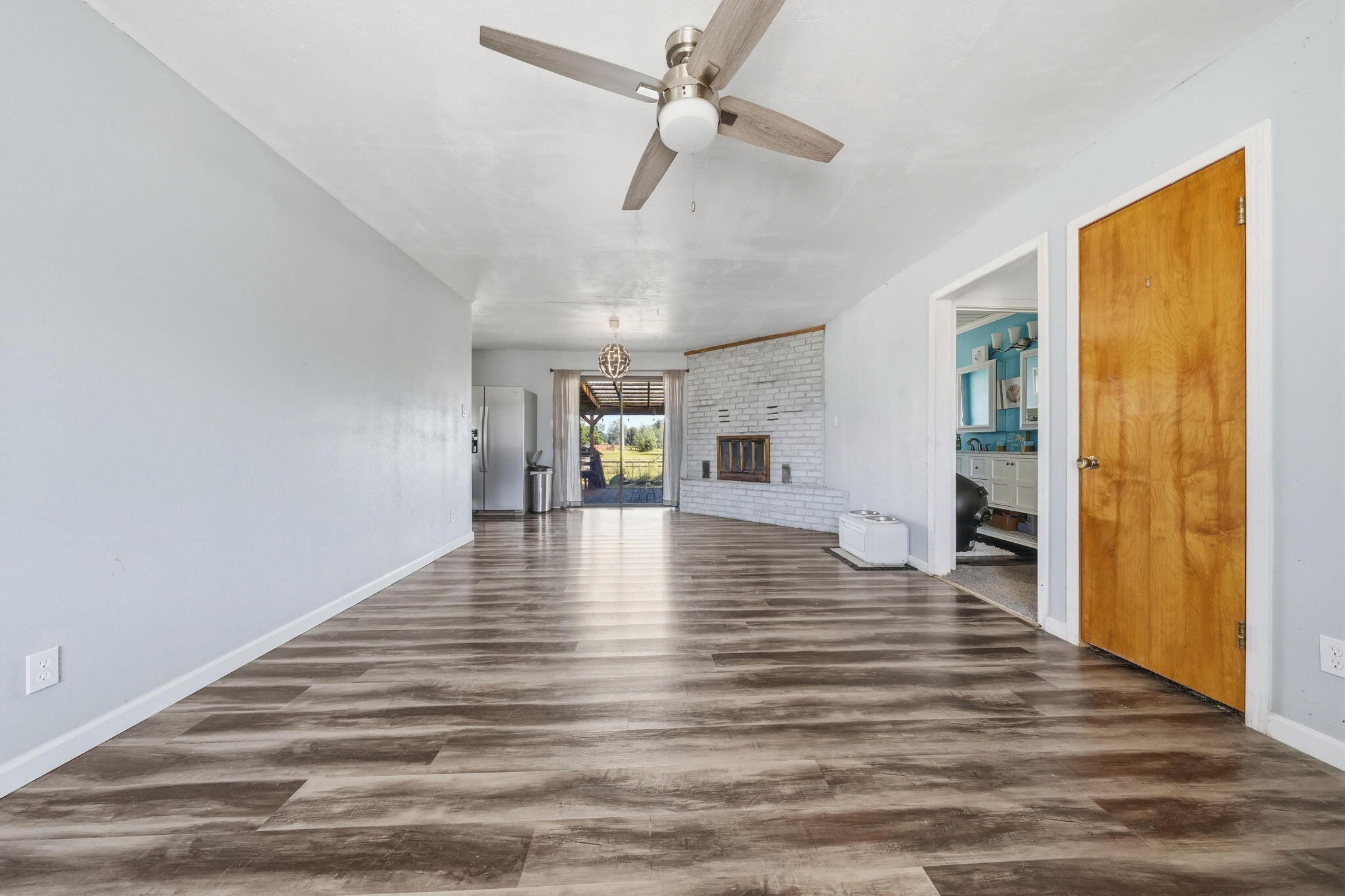 22189 Old Alturas Road Redding, CA 96003 - Photo 14 of 70 a view of empty room with wooden floor