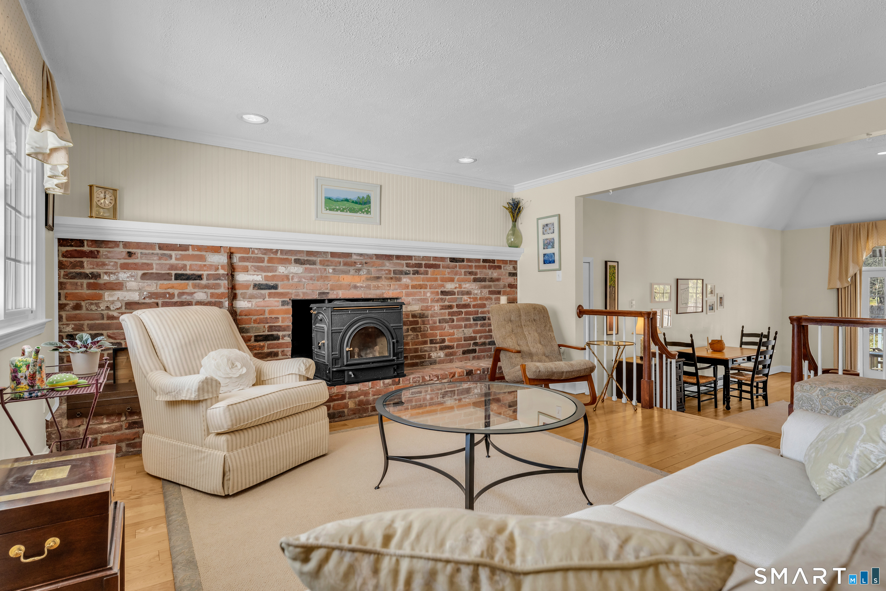 110 Nut Plains Road Guilford, CT 06437 - Photo 6 of 40 A full wall of exposed brick anchors the living room with warmth and character you simply cannot replicate.