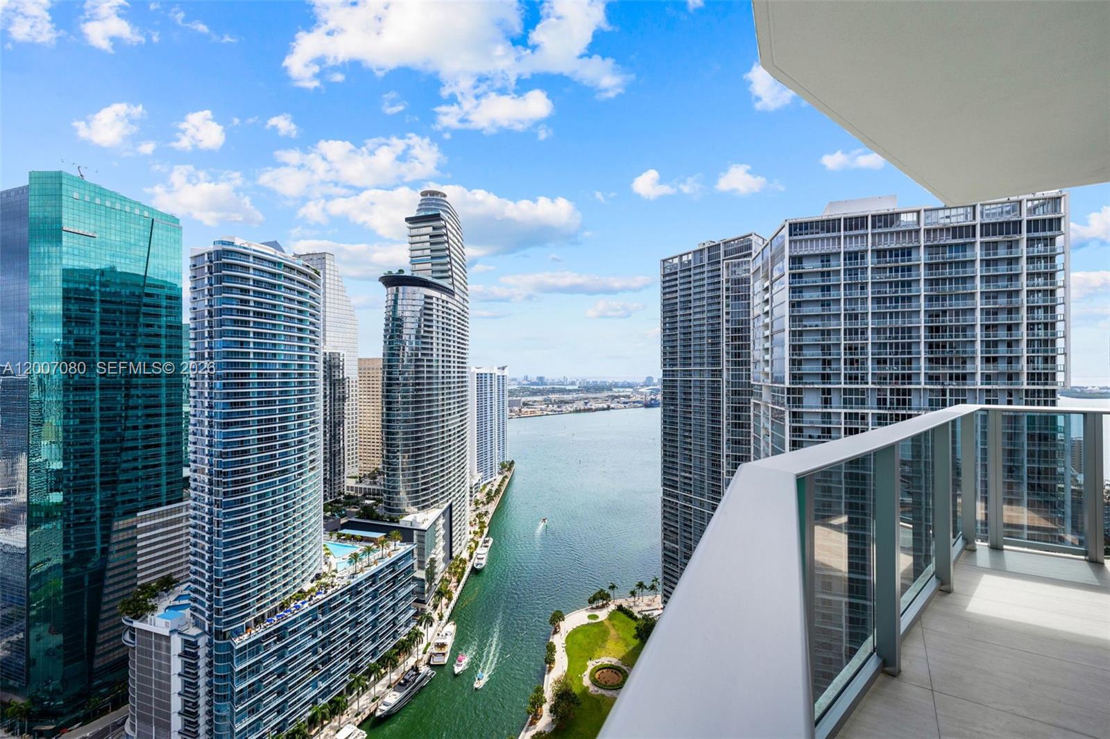 77 Southeast 5th Street, Unit PH01 Miami, FL 33131 - Photo 1 of 31 a view of balcony with two chairs and a table