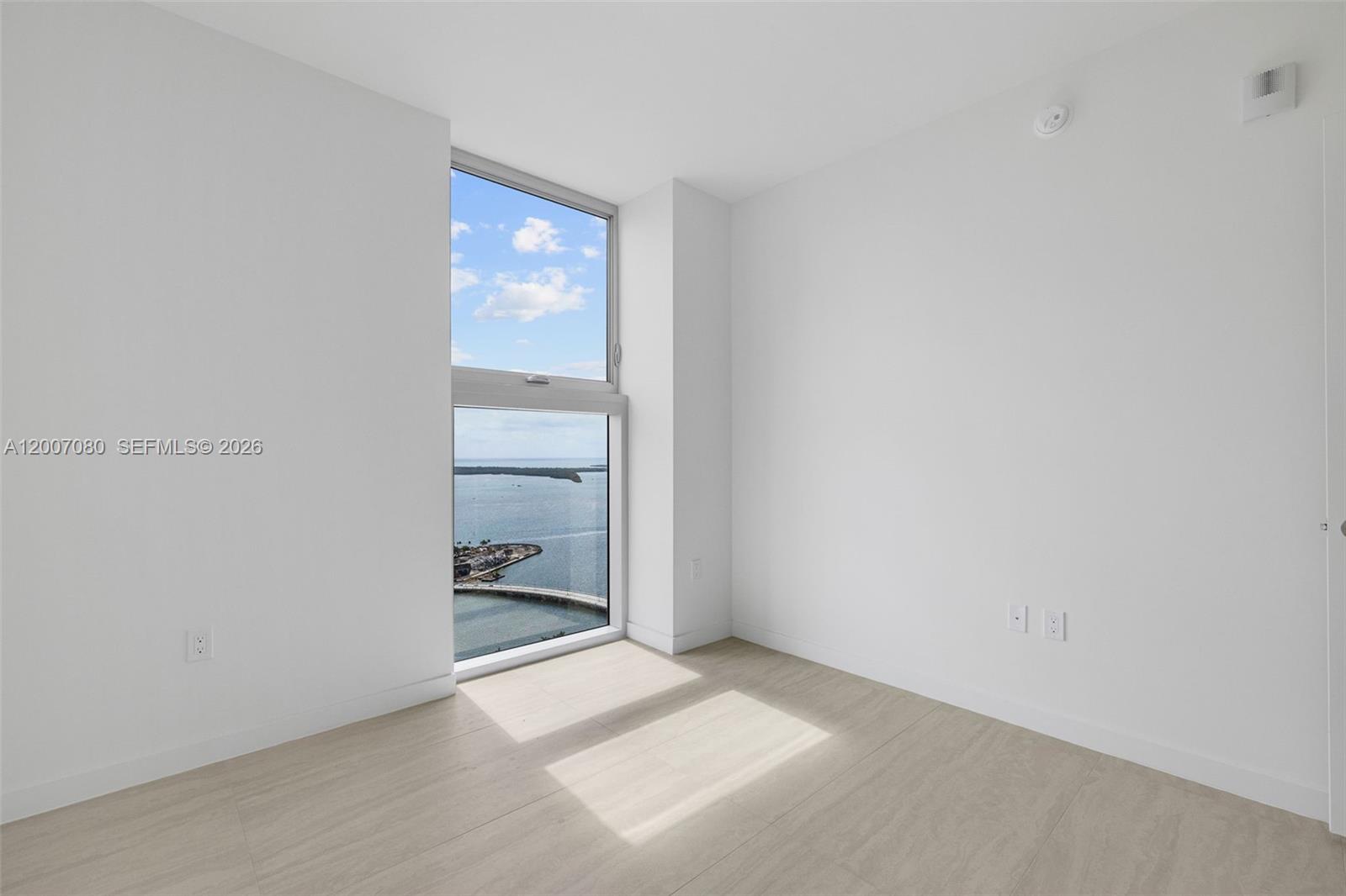 77 Southeast 5th Street, Unit PH01 Miami, FL 33131 - Photo 24 of 31 a view of an empty room and a window