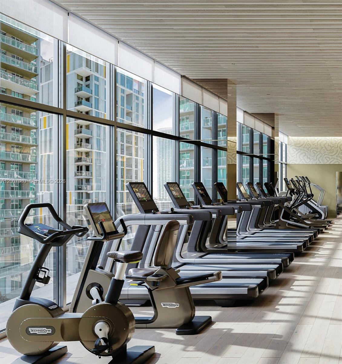 77 Southeast 5th Street, Unit PH01 Miami, FL 33131 - Photo 4 of 31 a view of a room with gym equipment