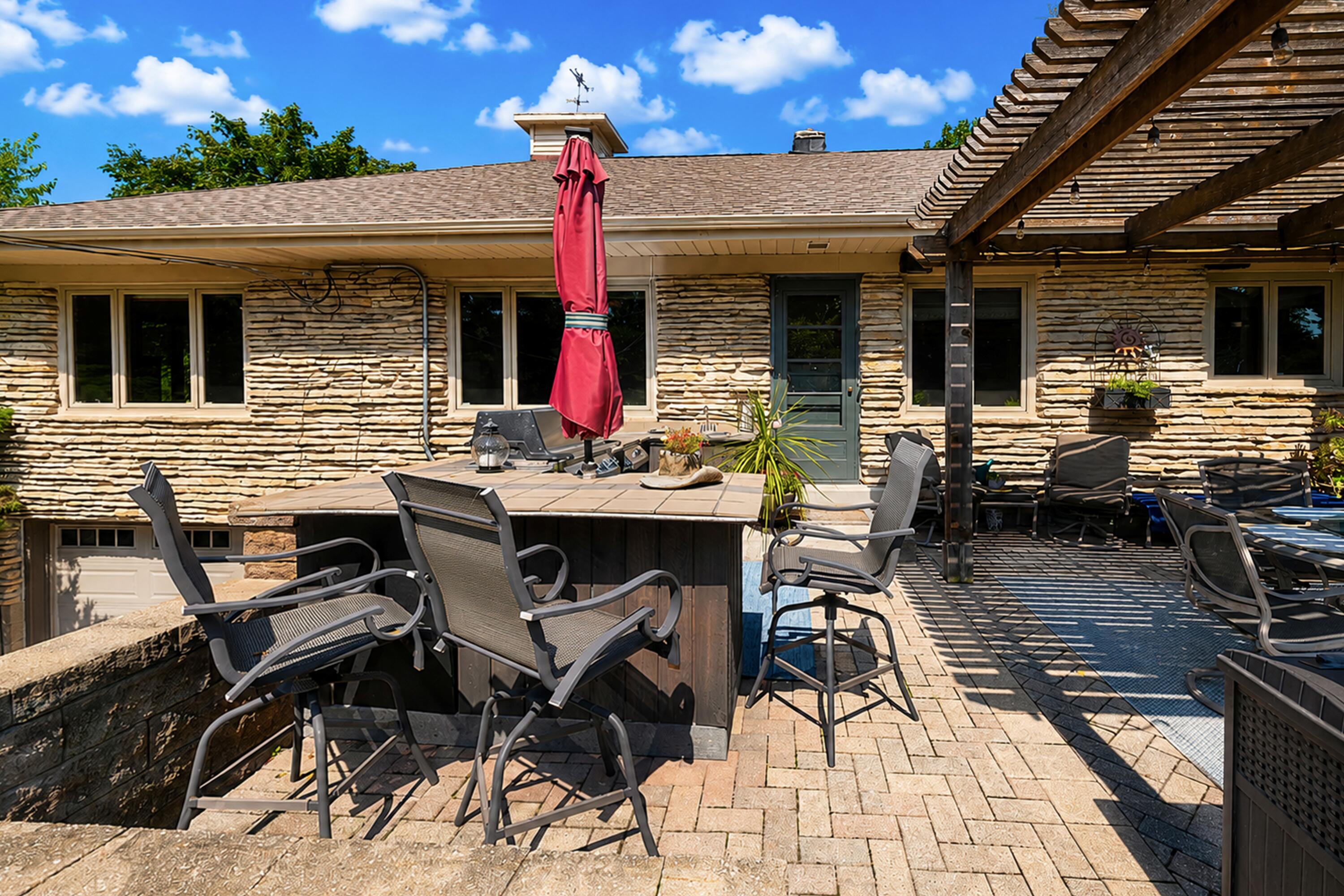 111 West Daphne Road Glendale, WI 53217 - Photo 38 of 45 Gorgeous landscaping, pergola, kitchenette, and more!