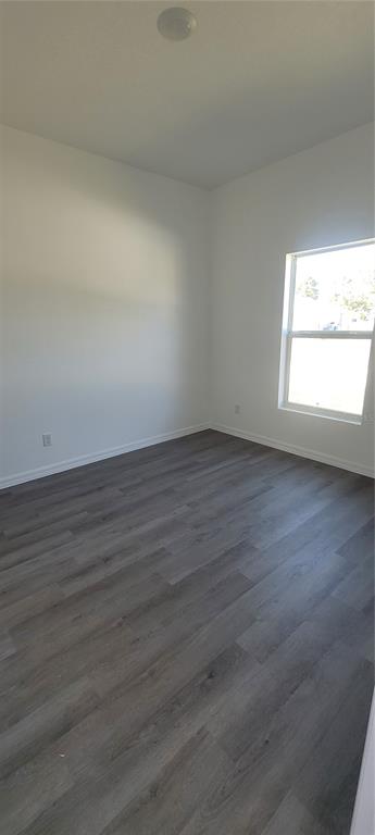 273 Santa Martia Street Southwest Palm Bay, FL 32908 - Photo 12 of 12 an empty room with wooden floor and windows