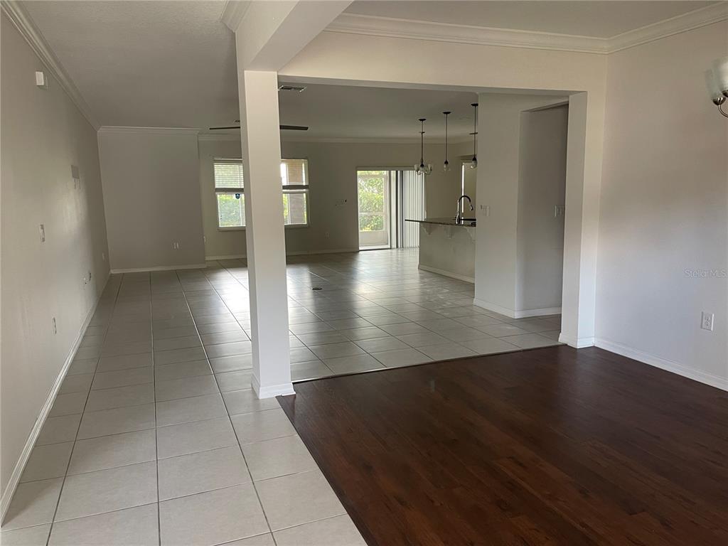 1312 Ralph Poe Drive Apopka, FL 32703 - Photo 5 of 14 wooden floor in a hall with a window