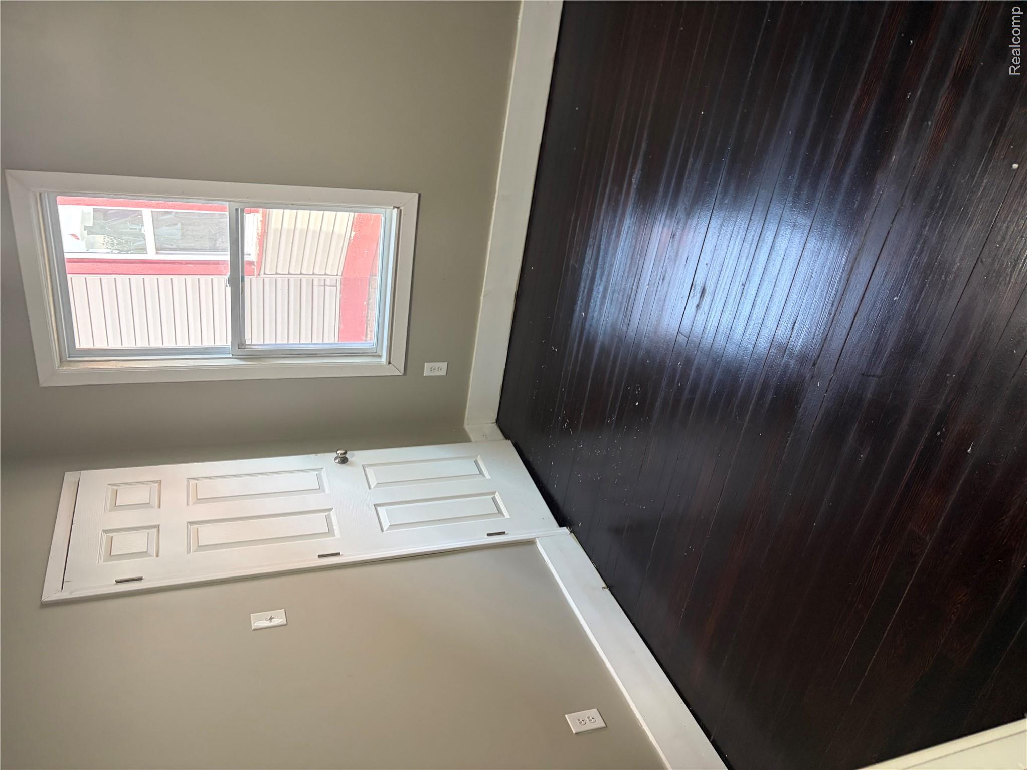 2420 Field Street Detroit, MI 48214 - Photo 13 of 15 Spare room featuring dark wood-type flooring