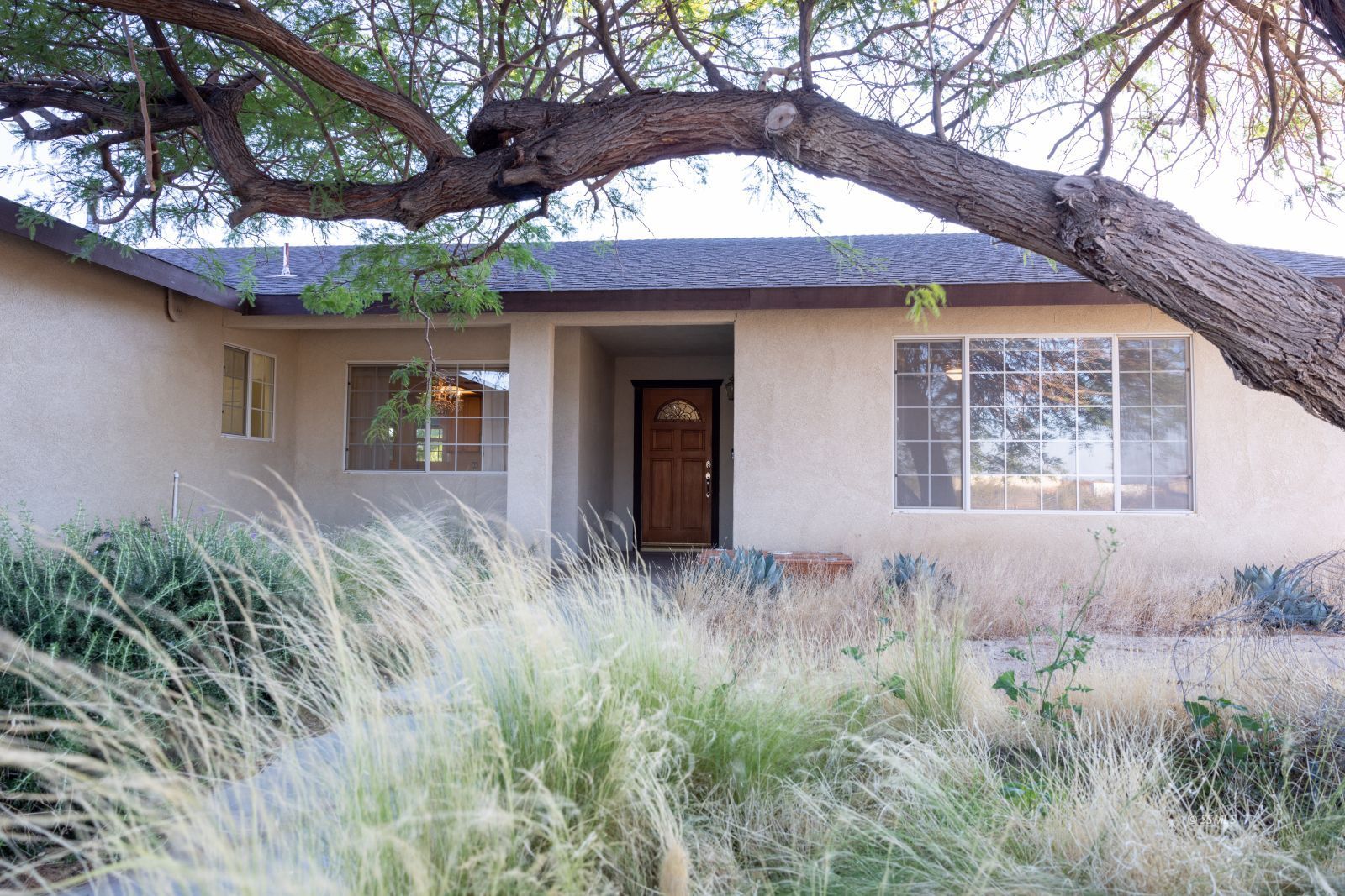 1359 Maturango Street Ridgecrest, CA 93555 - Photo 3 of 38 a front view of a house with yard