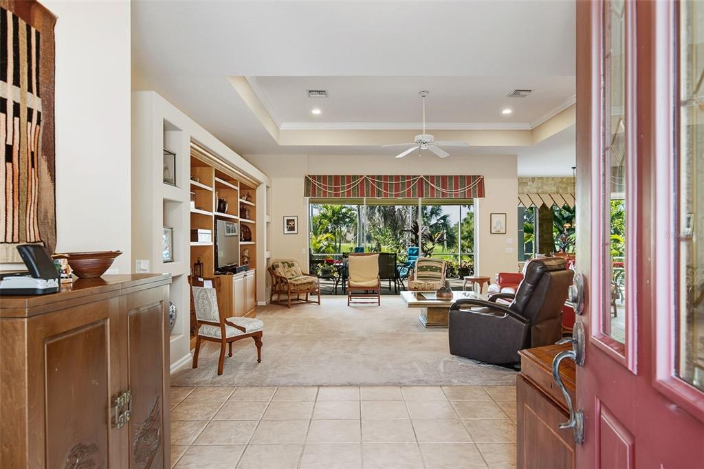 2116 Muskogee Trail Nokomis, FL 34275 - Photo 17 of 62 a living room with furniture and large windows