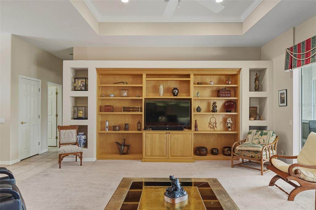 2116 Muskogee Trail Nokomis, FL 34275 - Photo 21 of 62 a room with furniture and a flat screen tv