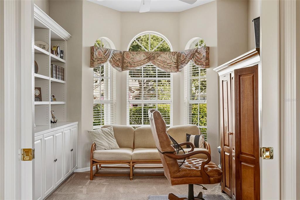 2116 Muskogee Trail Nokomis, FL 34275 - Photo 23 of 62 a living room with furniture and a window