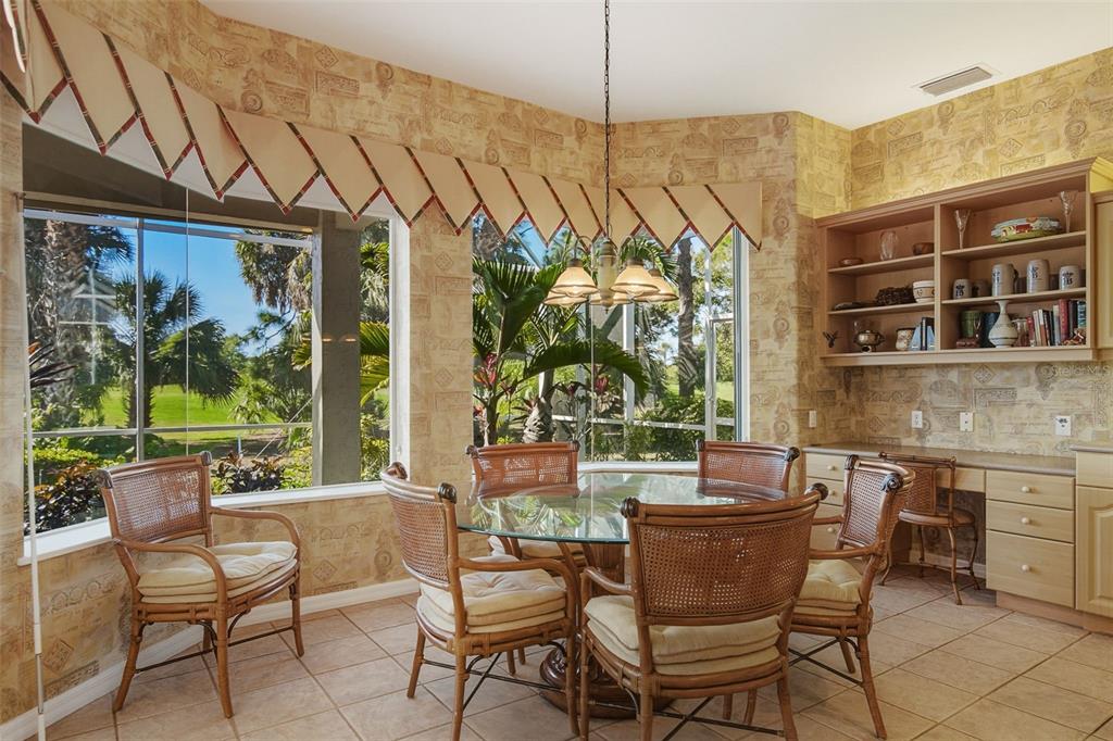2116 Muskogee Trail Nokomis, FL 34275 - Photo 32 of 62 a view of a patio with a table and chairs