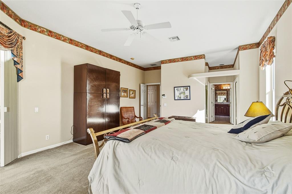 2116 Muskogee Trail Nokomis, FL 34275 - Photo 36 of 62 a bedroom with a bed window and table