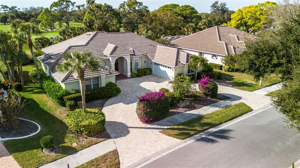 2116 Muskogee Trail Nokomis, FL 34275 - Photo 4 of 62 a view of a house with a yard and garden
