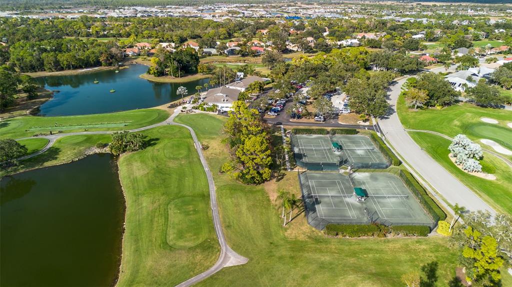 2116 Muskogee Trail Nokomis, FL 34275 - Photo 53 of 62 an aerial view of residential houses with outdoor space and swimming pool