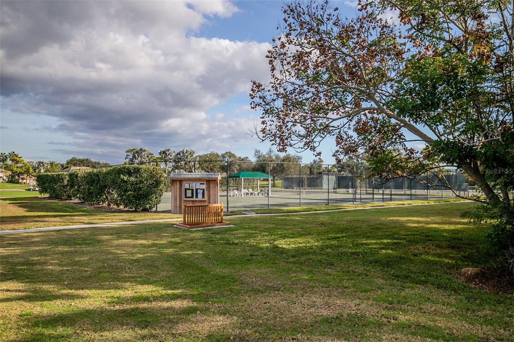 2116 Muskogee Trail Nokomis, FL 34275 - Photo 55 of 62 a view of a golf course with a lake