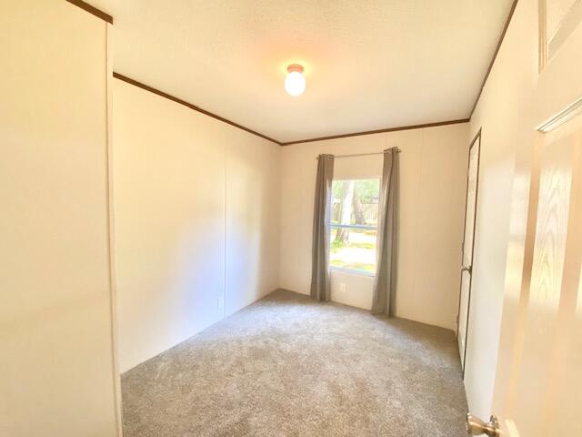 54 Tomahawk Street Niceville, FL 32578 - Photo 15 of 19 a view of an empty room with a window