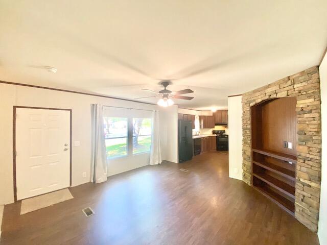 54 Tomahawk Street Niceville, FL 32578 - Photo 3 of 19 wooden floor in an empty room with a window