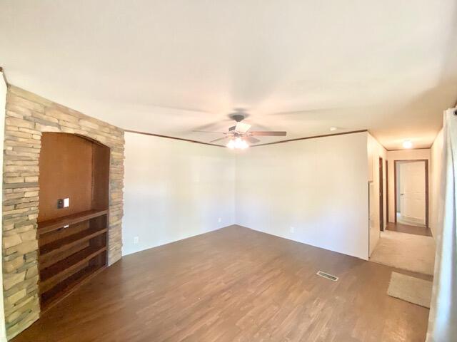 54 Tomahawk Street Niceville, FL 32578 - Photo 6 of 19 a view of empty room with wooden floor and fan