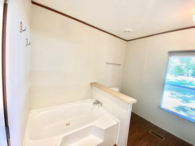 54 Tomahawk Street Niceville, FL 32578 - Photo 10 of 19 a bathroom with a tub and shower