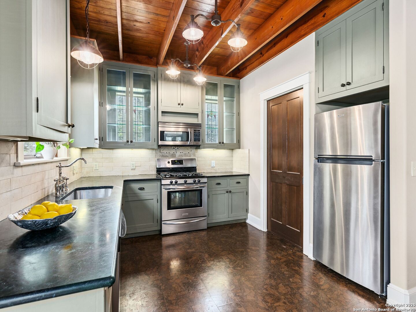 146-144 Ranger Creek Road Boerne, TX 78006 - Photo 37 of 50 a kitchen with stainless steel appliances a stove a refrigerator and a sink